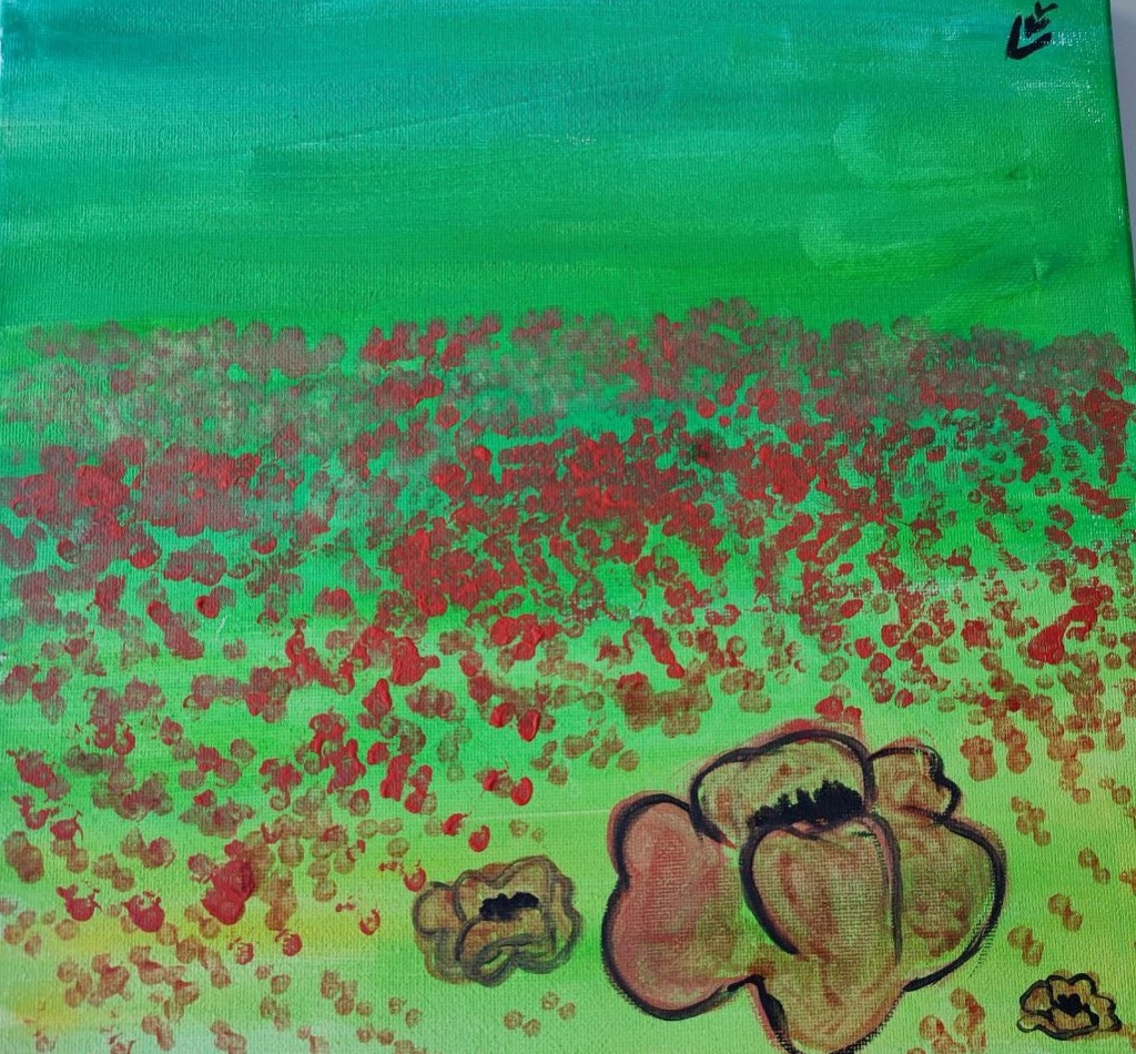 Green field with red poppies