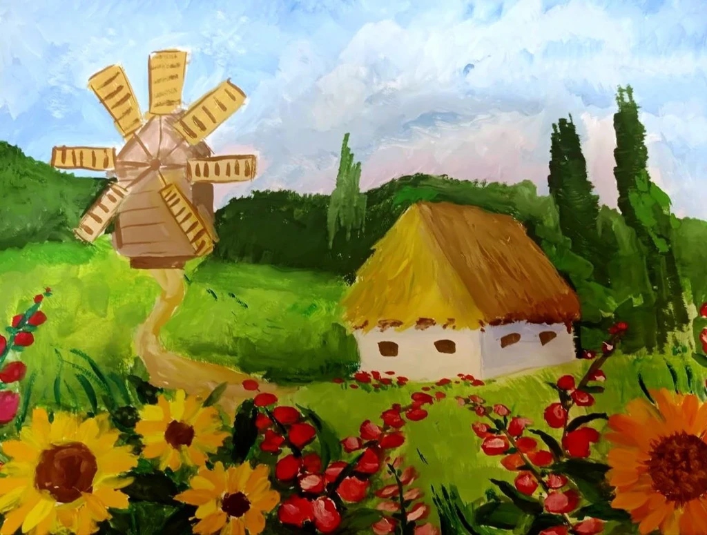 Ukrainian village with windmill and sunflowers